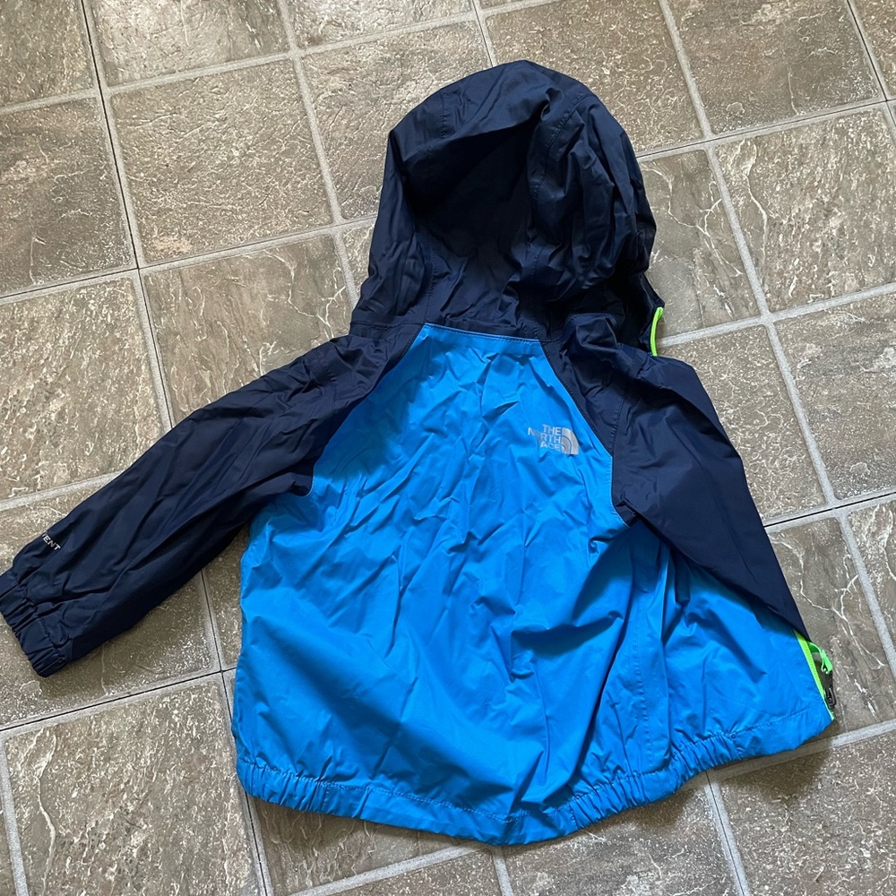 Baby Antora North Face Rain coat size 6-12 months color blue and green